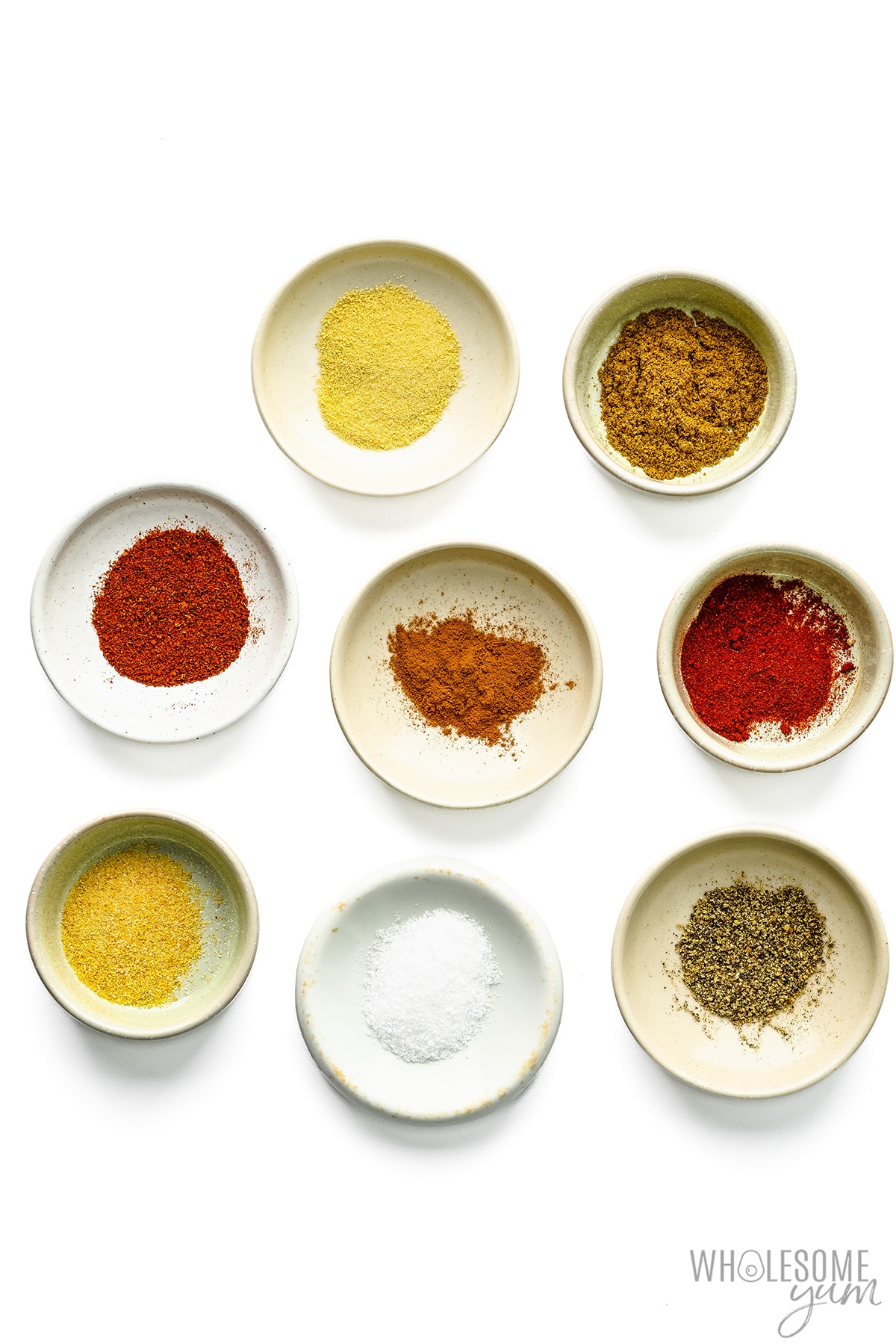 Keto spices measured out in bowls.