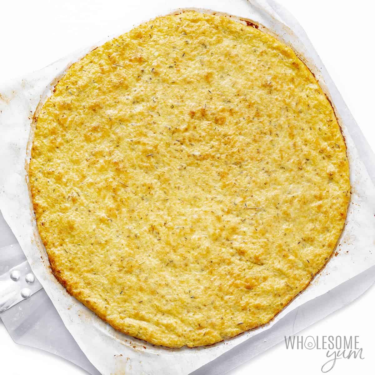 Baked cauliflower crust before topping.