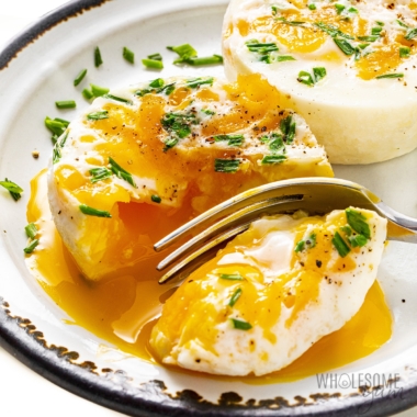 Coddled eggs with fork.