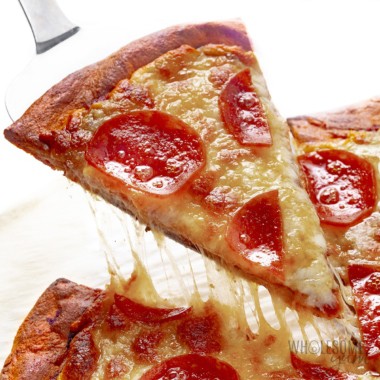 Keto pizza slice made with fathead dough.