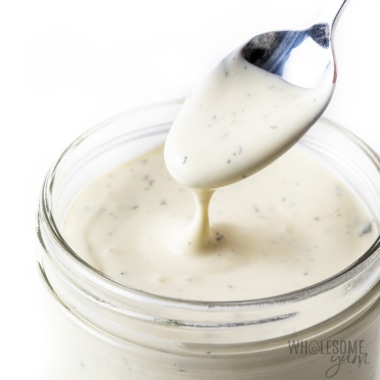 Ranch dressing recipe in a mason jar with a spoon.