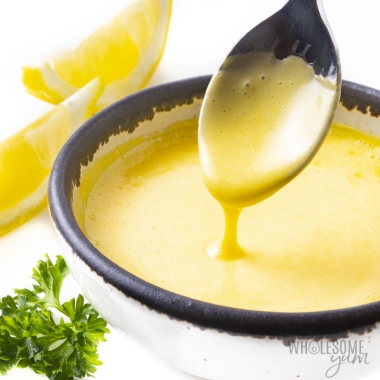 Homemade hollandaise sauce recipe close up on a spoon