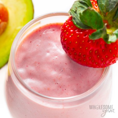 Keto smoothie recipe in a glass with garnishes.