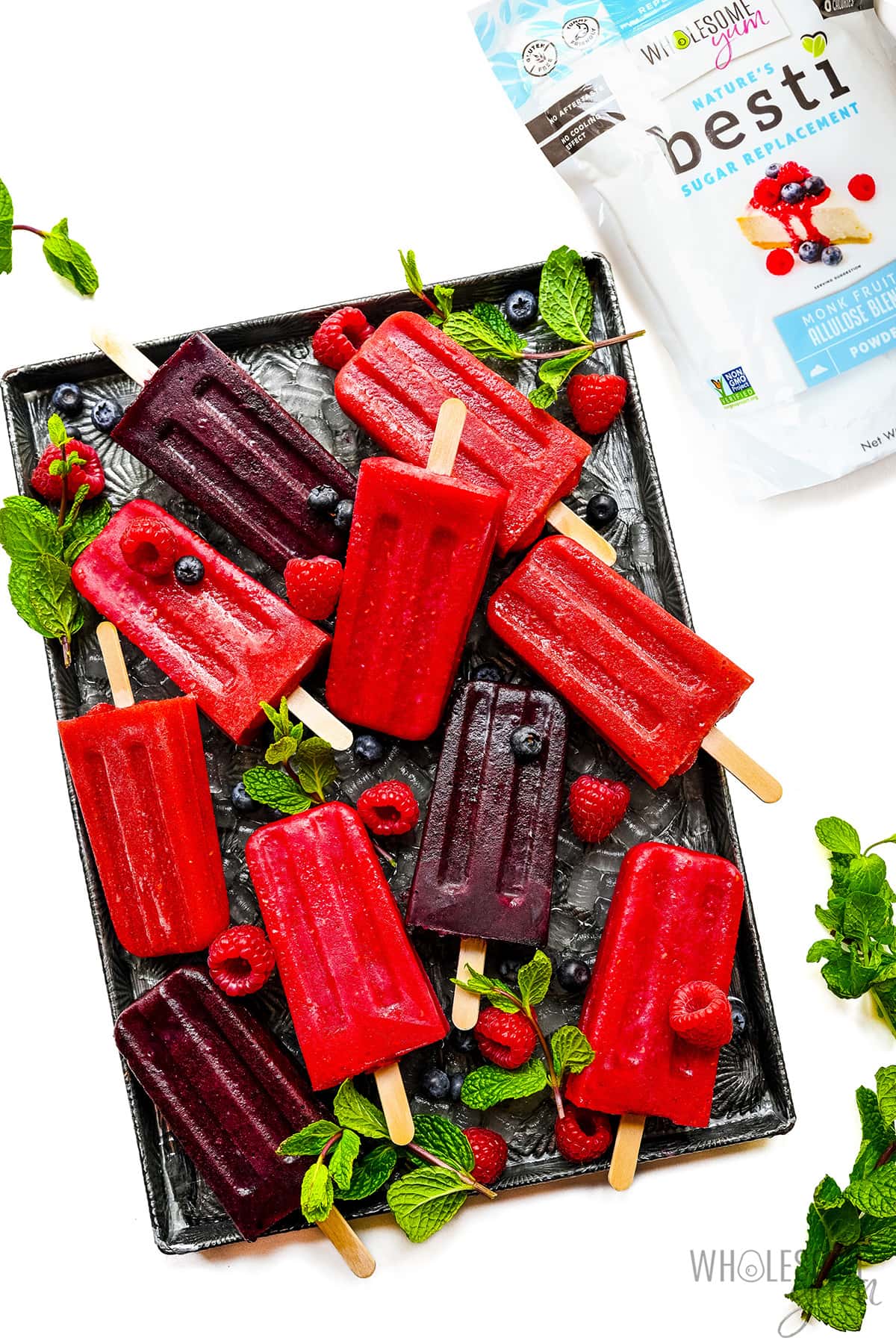 Sugar free popsicles on baking sheet next to powdered Besti.