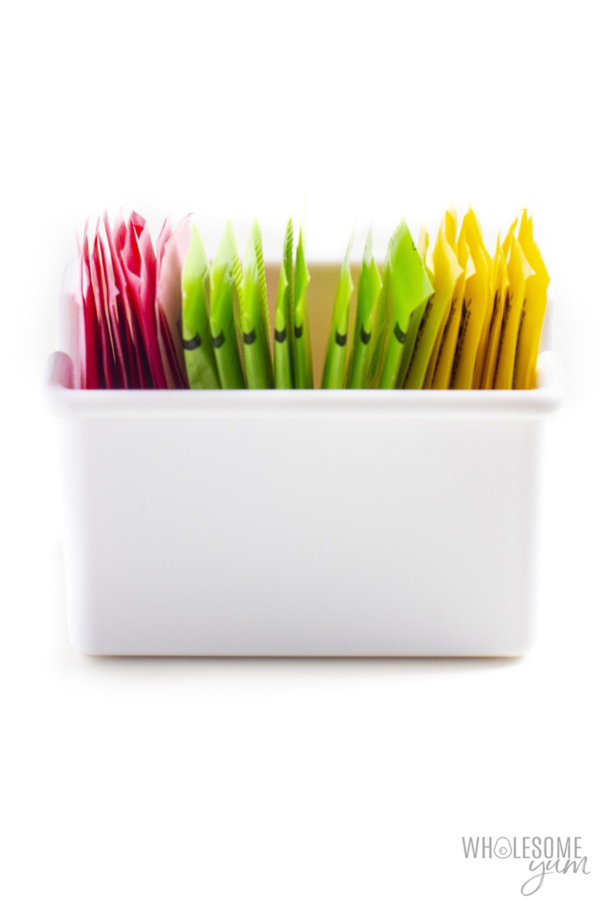 Container of artificial sweetener packets.