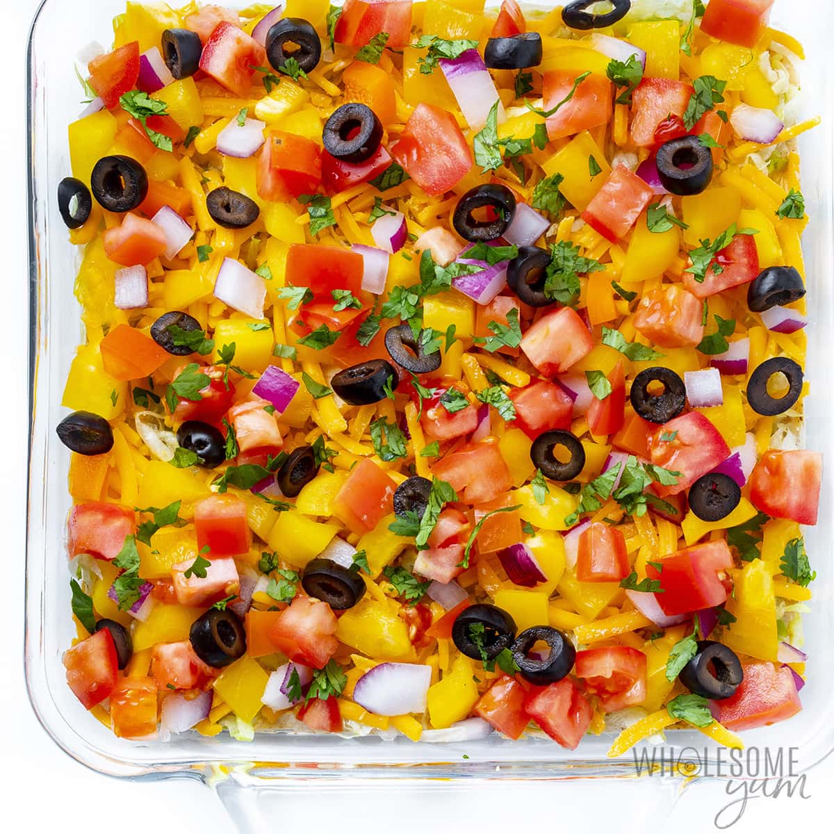 Layered taco dip with meat.