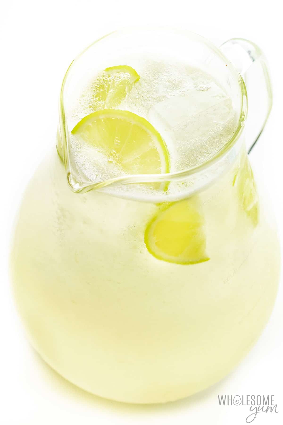 Skinny margarita on the rocks in a pitcher.