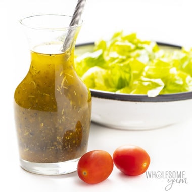 bottle of Italian dressing with lettuce
