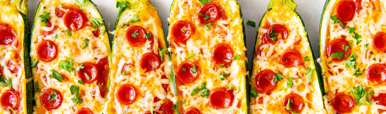 Wholesome Yum app zucchini pizza boats.